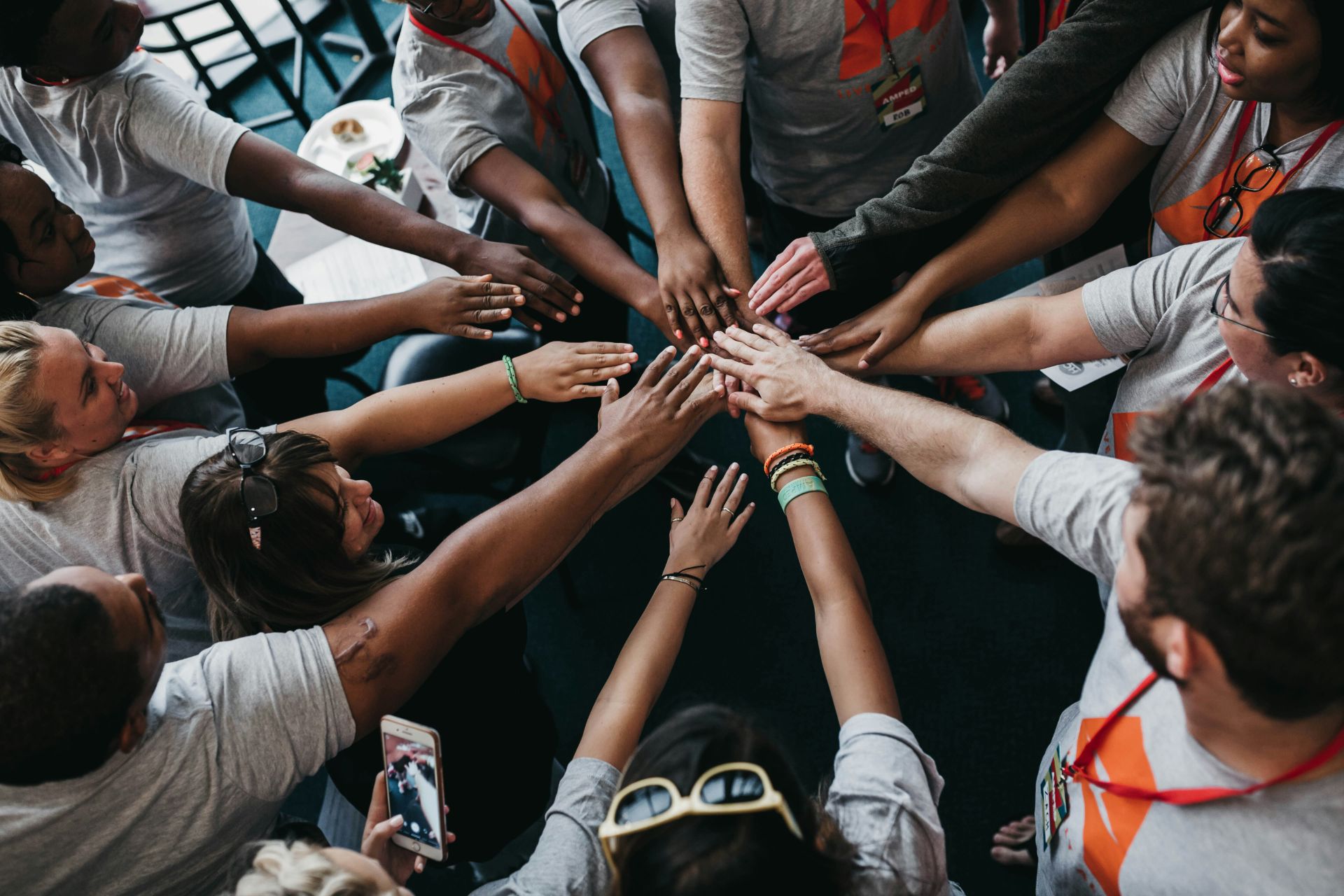 Hands gently linked together symbolizing community support